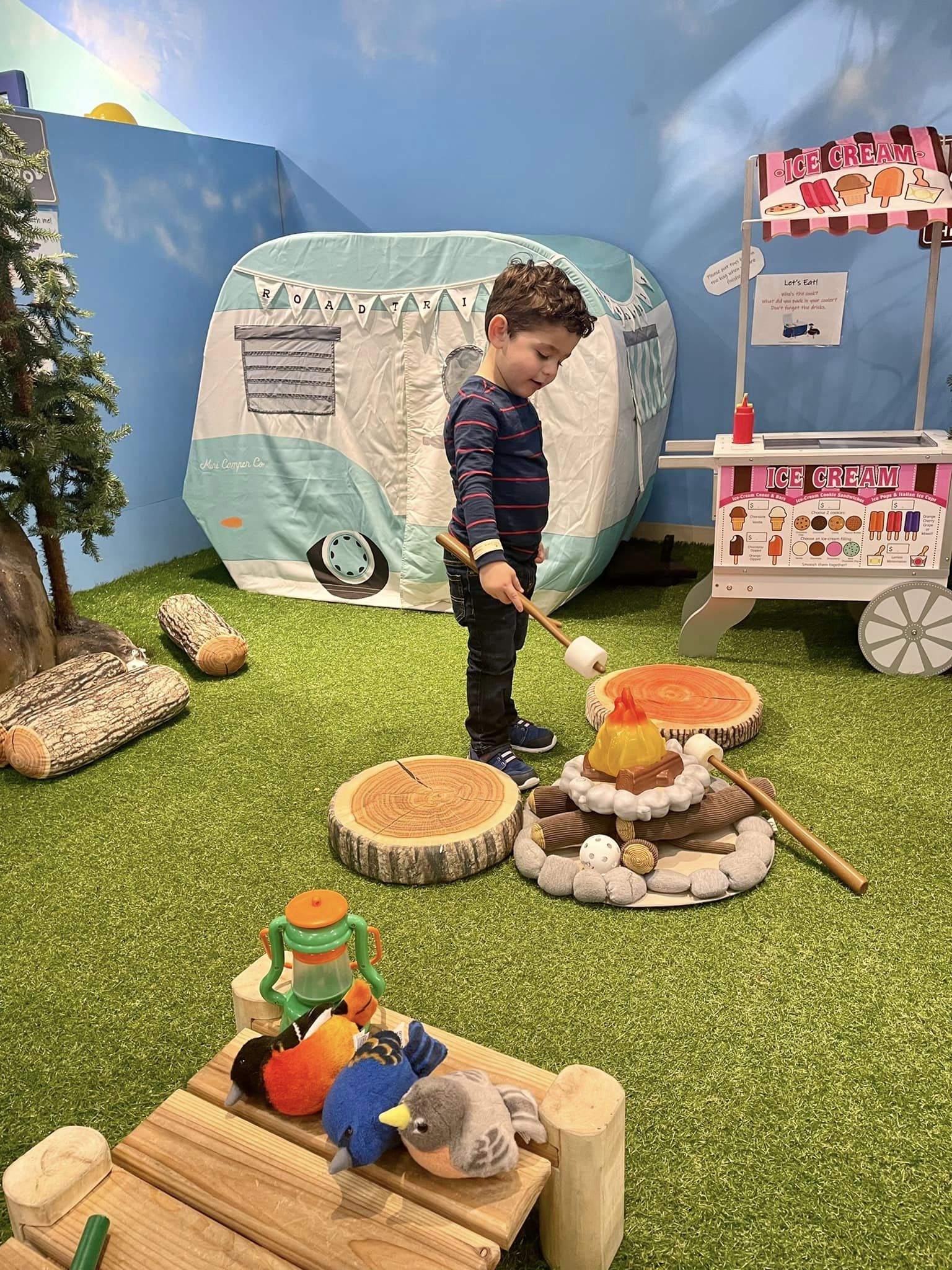 Camping-themed indoor play area at Playseum