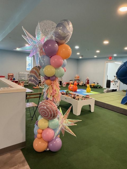 Indoor playroom setup at Bibbly Boo Toy & Candy Shoppe.