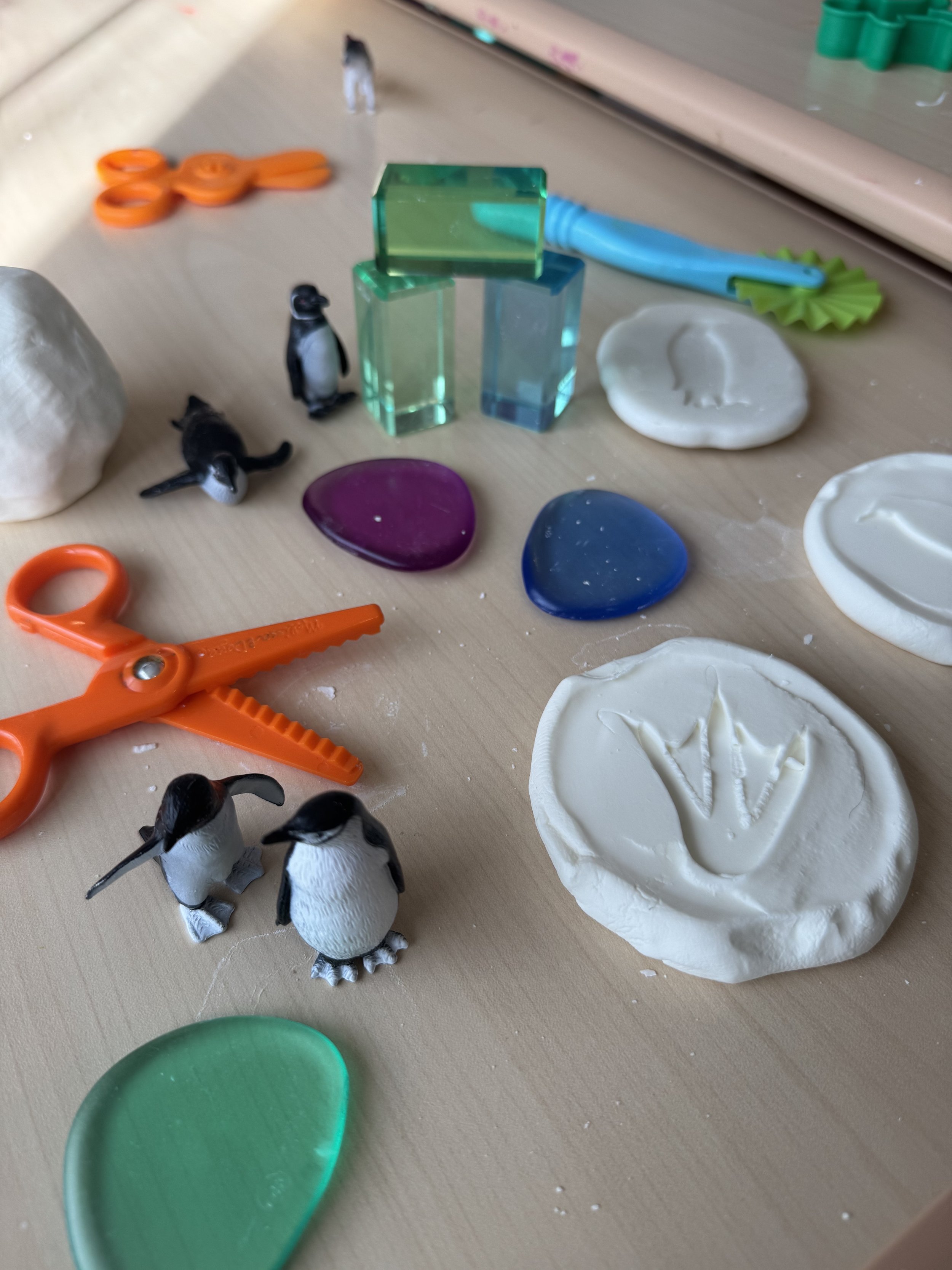Tabletop sensory and fine-motor setup at Blossom Play Space.