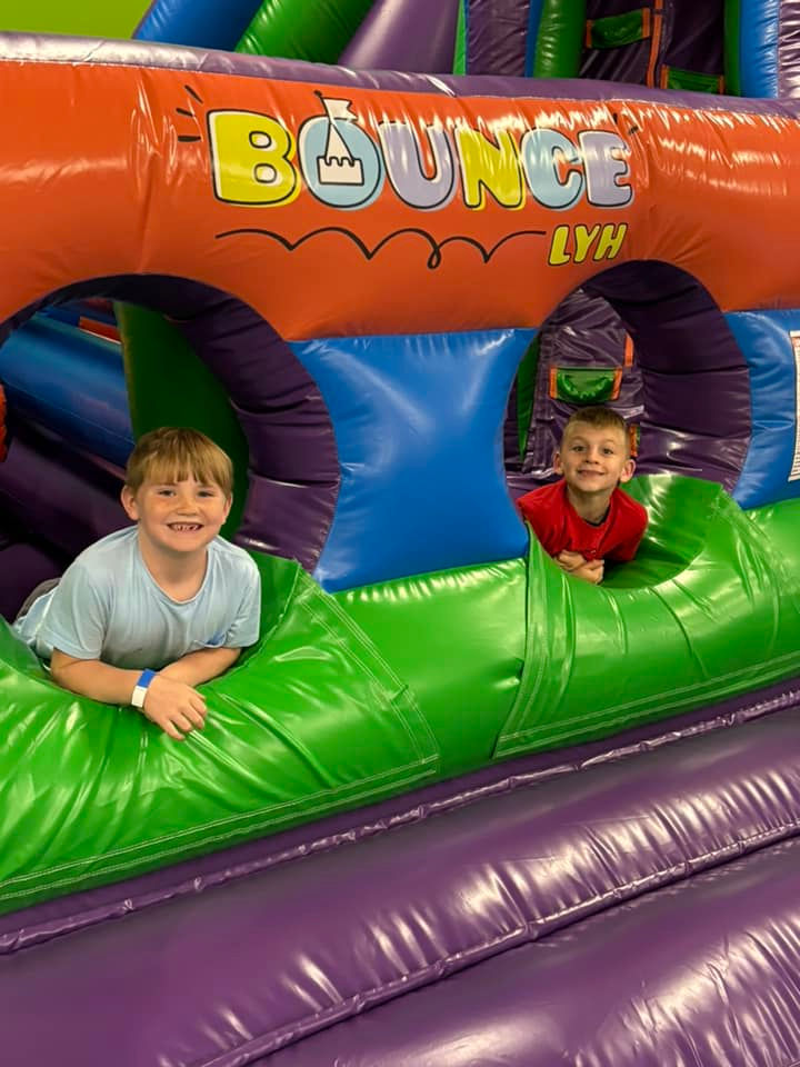 Kids playing on inflatables at Bounce LYH.