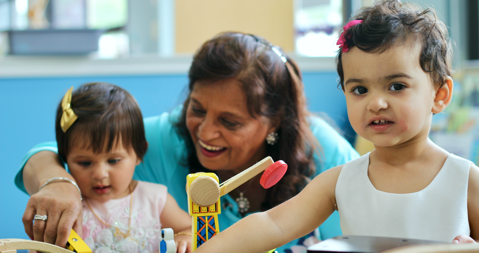 Caregiver and child enjoying the play space at Bug & Goose Play Cafe.