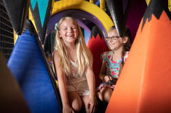 Children sitting inside the soft-play maze at Cactus Jack's Playhouse.