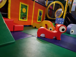 Soft toddler-friendly floor play area inside Cactus Jack's Playhouse.