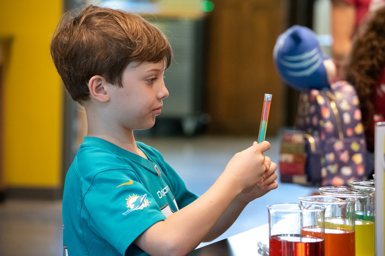 Children engaged in a creative activity at the Cade Museum