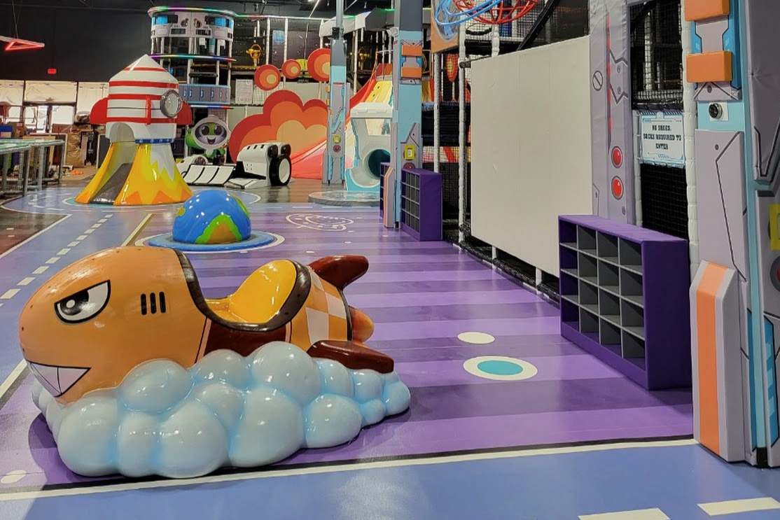 Indoor play structure at Catch Air Austin with climbing features.