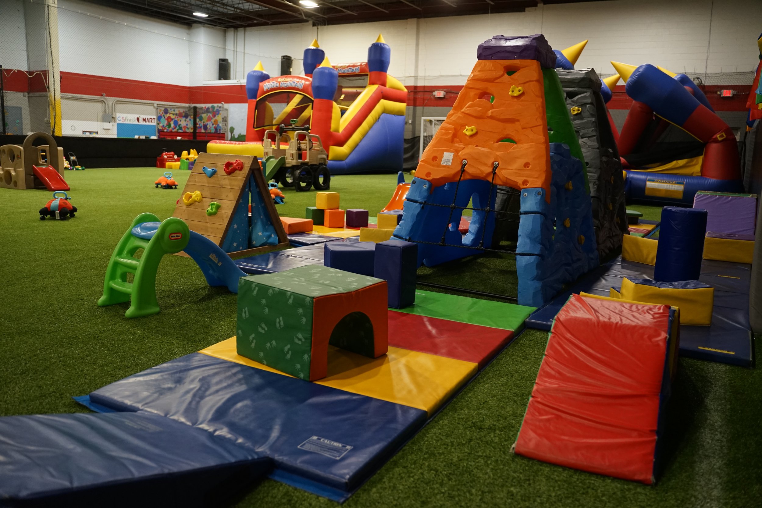 Climbing and toddler play area at Chatter Splatter Playgroup.