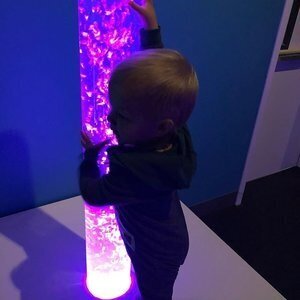 Child exploring a sensory feature at Chico Children's Museum