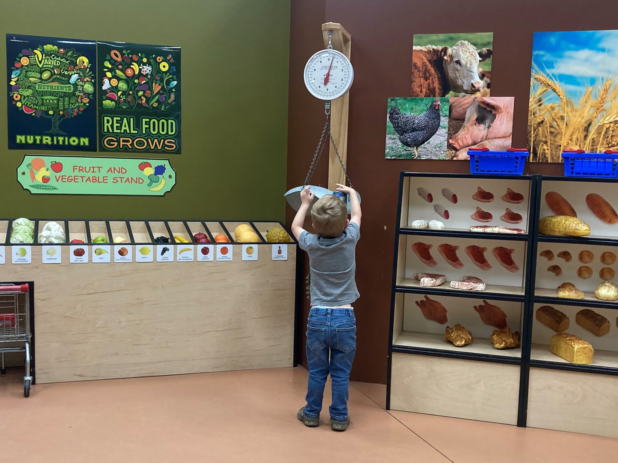 Children playing in the museum's kid-sized town exhibit area.