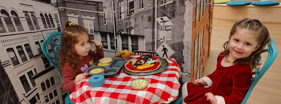 Children using a table exhibit in the museum.