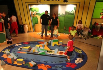 A bright exhibit area inside the Children's Hands-On Museum of Tuscaloosa.