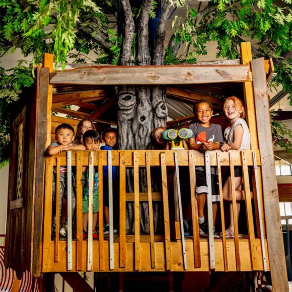 Children gathered in the treehouse at the Children's Museum of La Crosse.