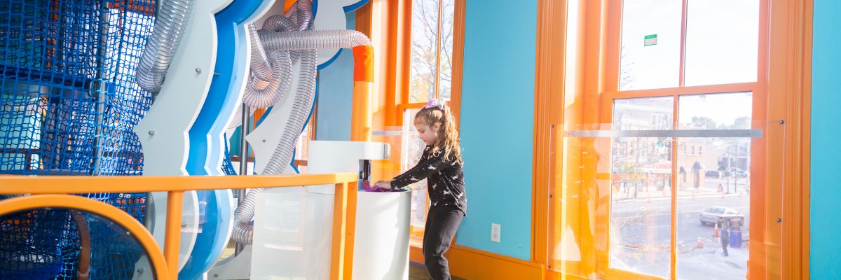 Children exploring museum exhibits at CMOO