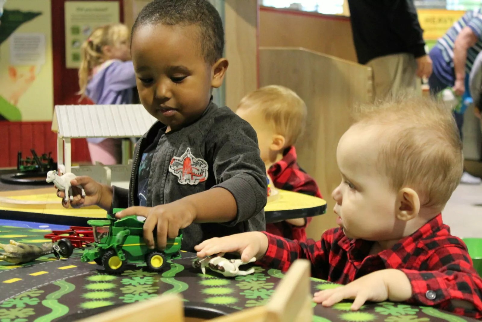 Children exploring a hands-on exhibit gallery at the Children's Museum of Southern Minnesota.