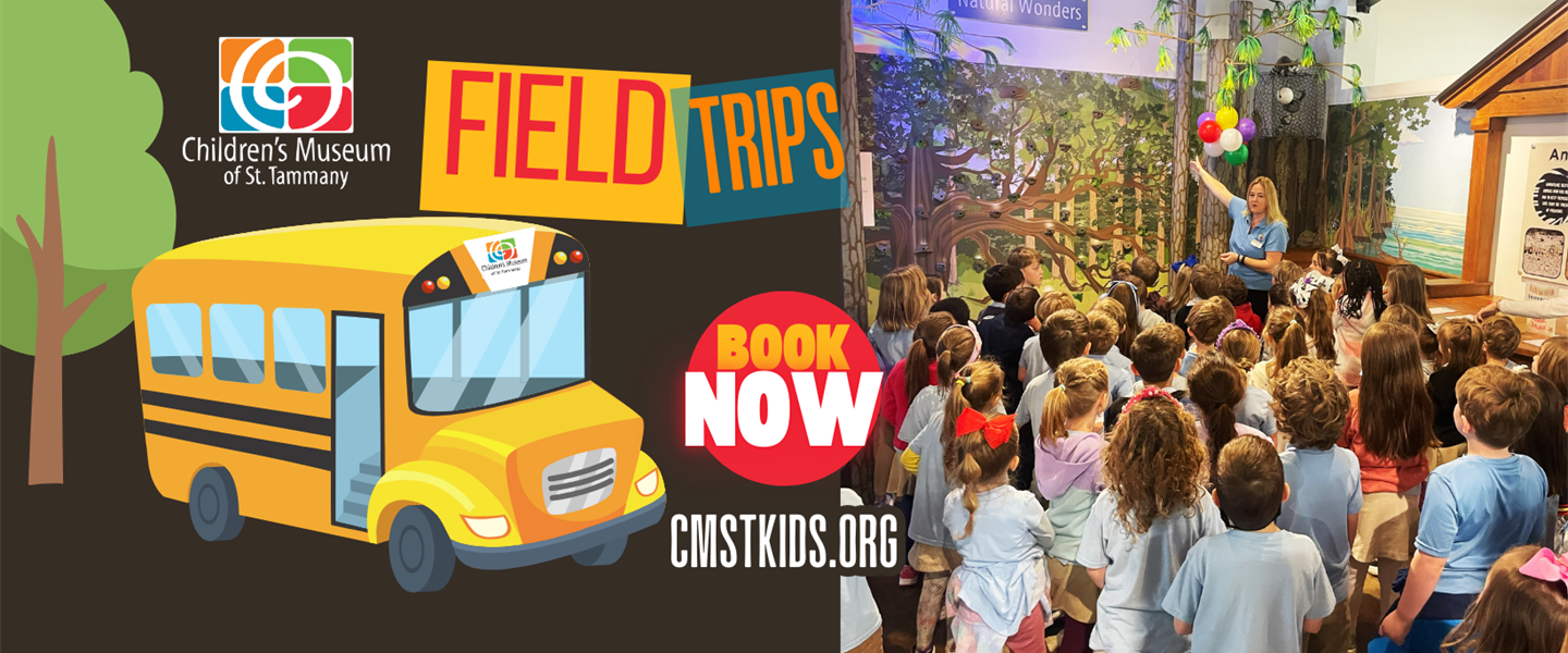 Children gathered around a tree-themed exhibit at the museum
