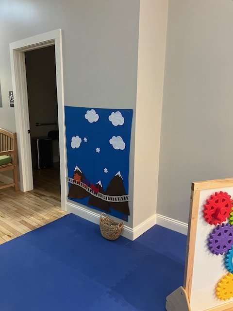 Sensory-style wall activity area inside the Children's Museum of the Northeast Kingdom.