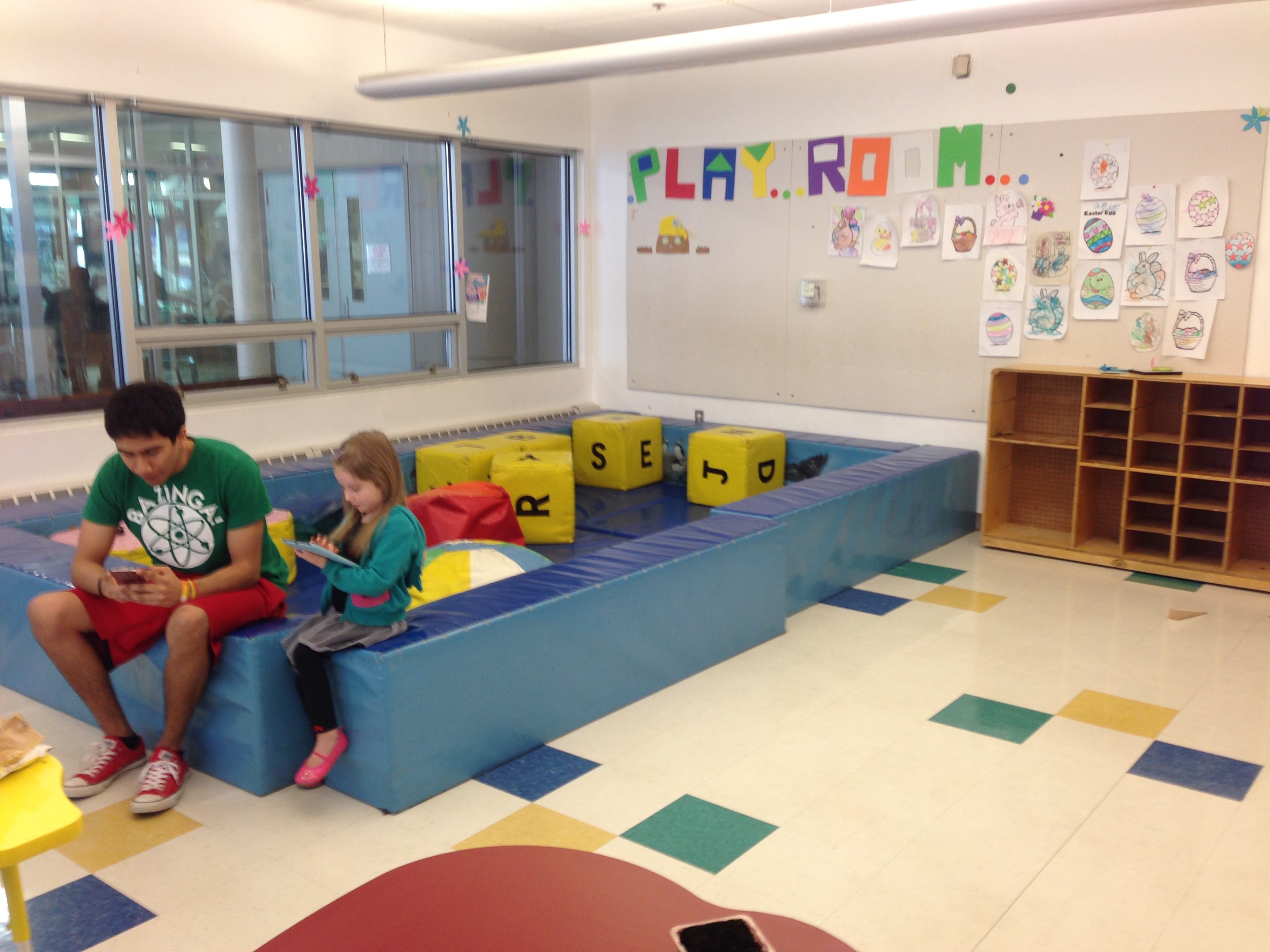 Foam play area inside the Children's Room with soft blocks and open floor space.