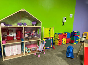 Pretend-play dollhouse area inside Children's World Indoor Playground.