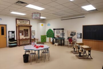 Tables and exhibit stations inside the Churchill County Museum Discovery Room
