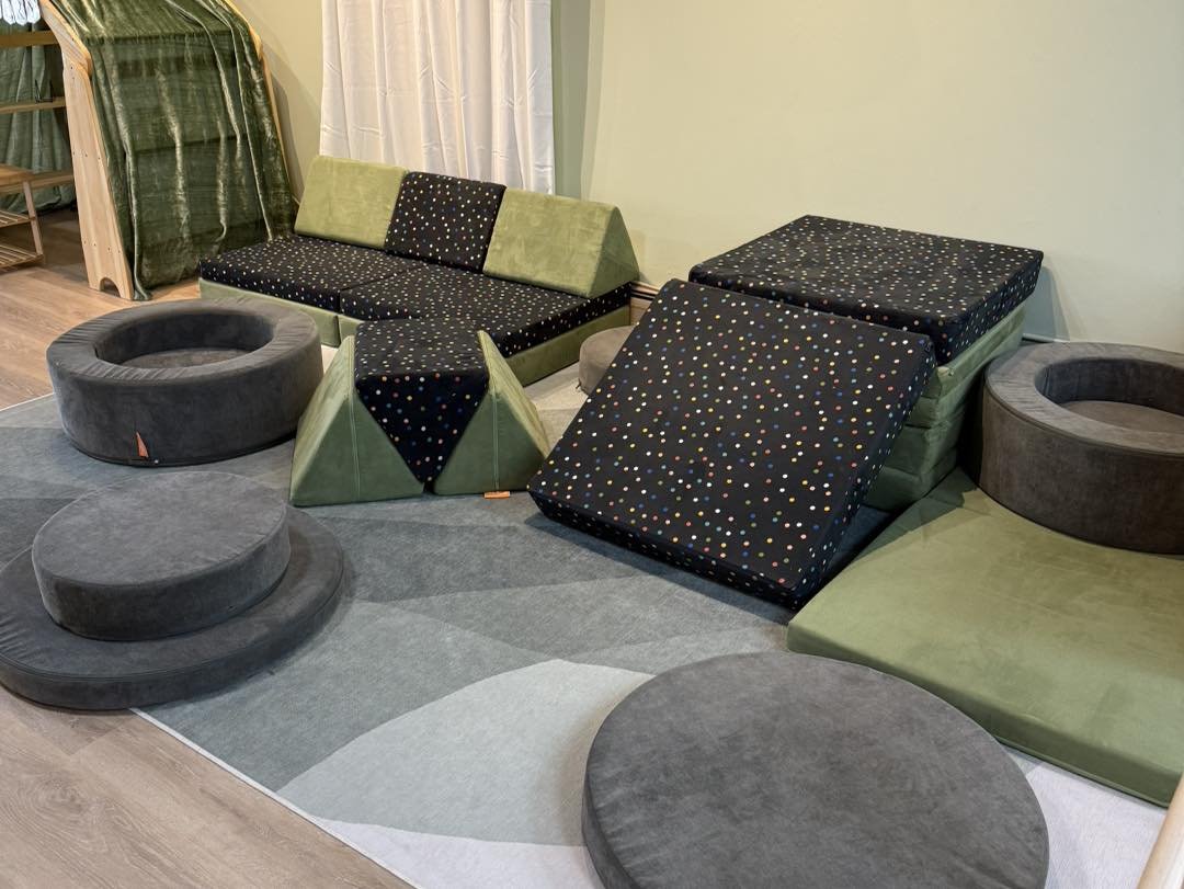 Indoor dramatic-play and activity area at Clover Exploration.
