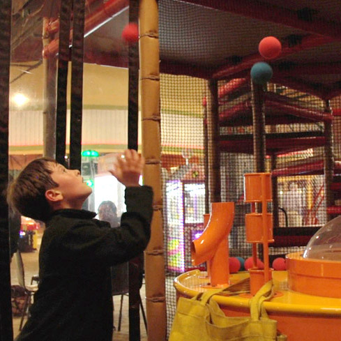 Child playing inside the Ballocity attraction at The Clubhouse Statesboro