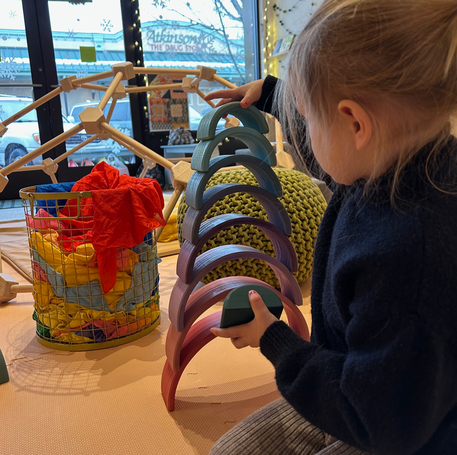A child exploring tabletop materials at Cocoon Hailey.