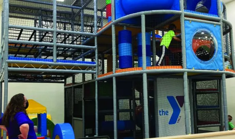The Adventure Center climbing structure with soft-play elements at the Corning Family YMCA.