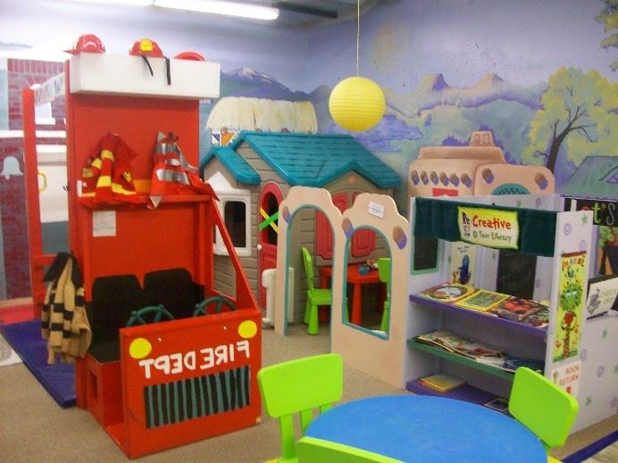Pretend-play and dramatic-play stations at Creative Play Place.