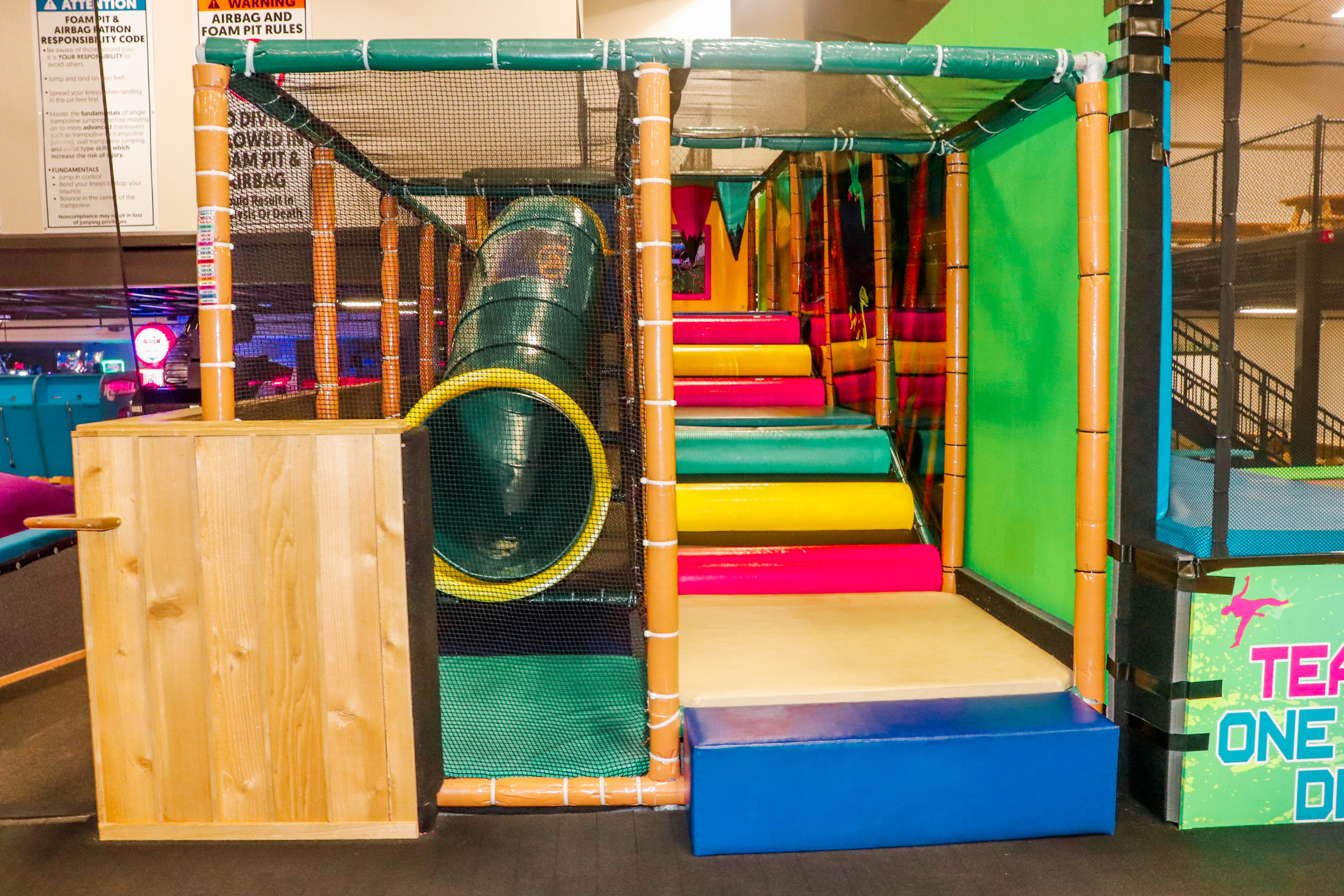 Soft-play climbing tunnel and padded toddler area inside Da Swamp.