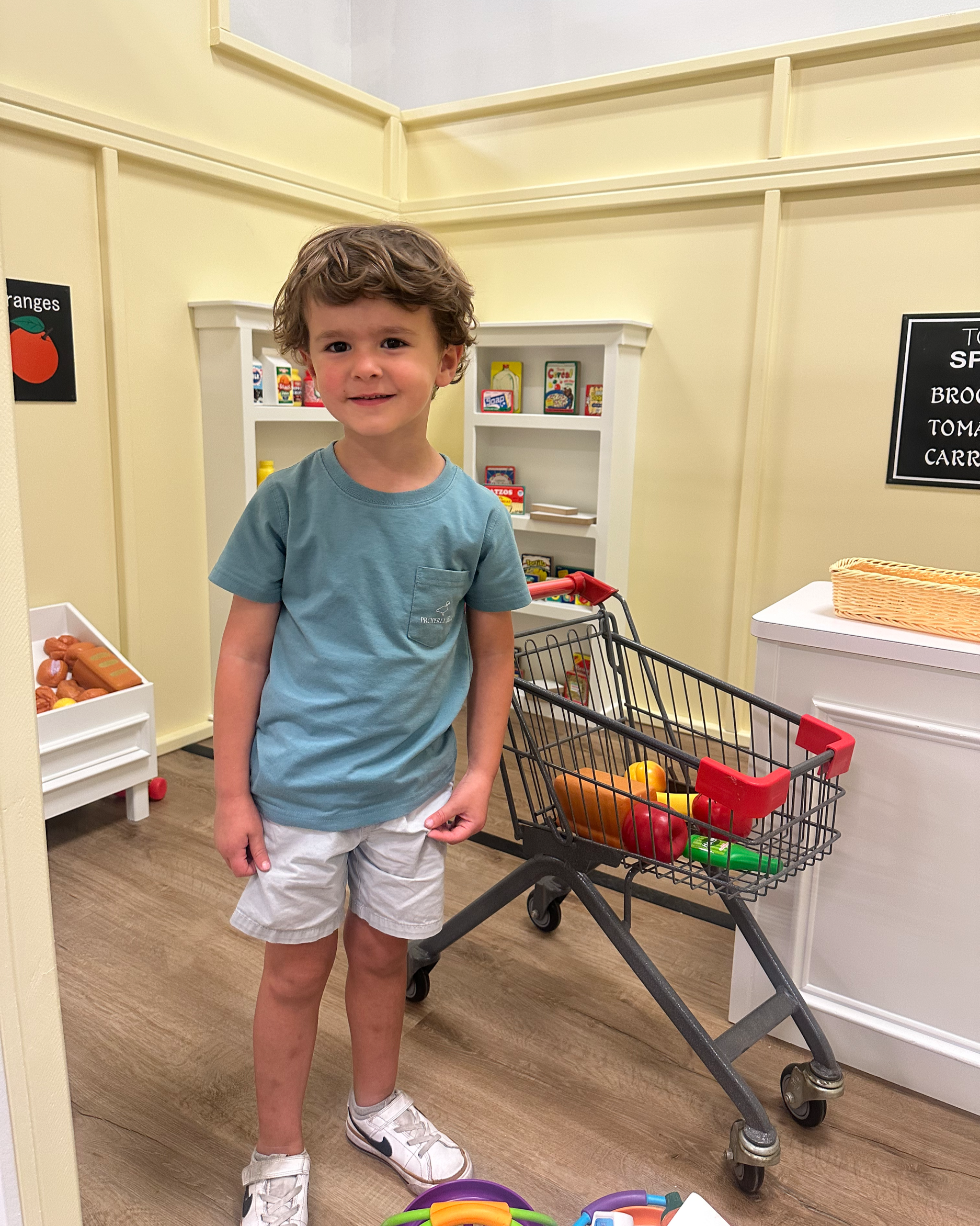 Indoor play seating and family lounge area at Dandelion Play Cafe