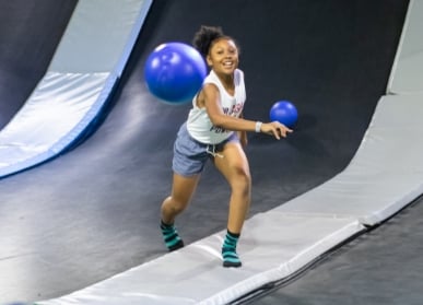 Kids playing dodgeball at DEFY