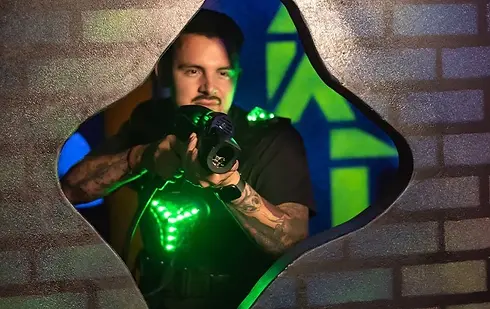 Players inside the bazooka ball arena at Emerald Coast Mirror Maze & Laser Craze