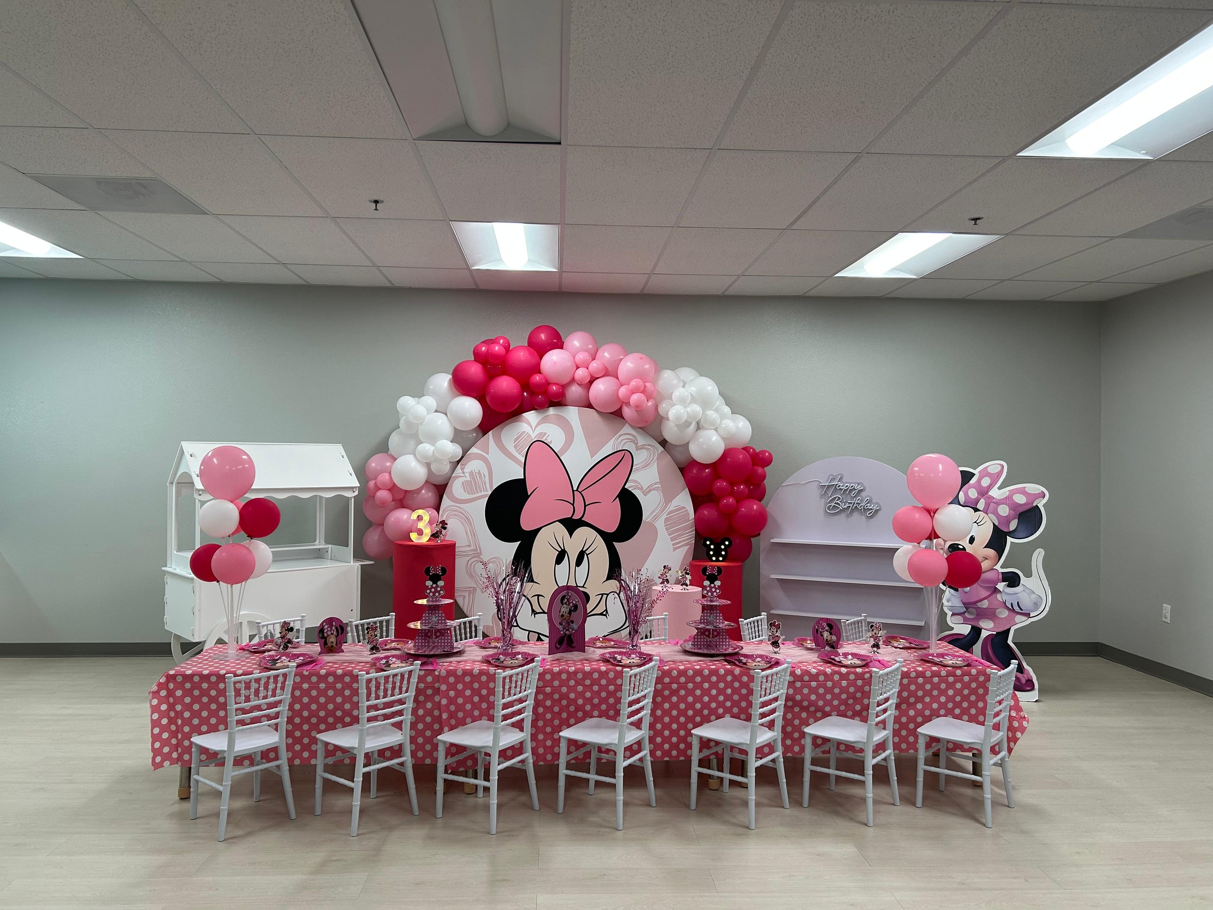Pink Minnie-themed birthday setup inside the party room at Enchanted Elk Grove