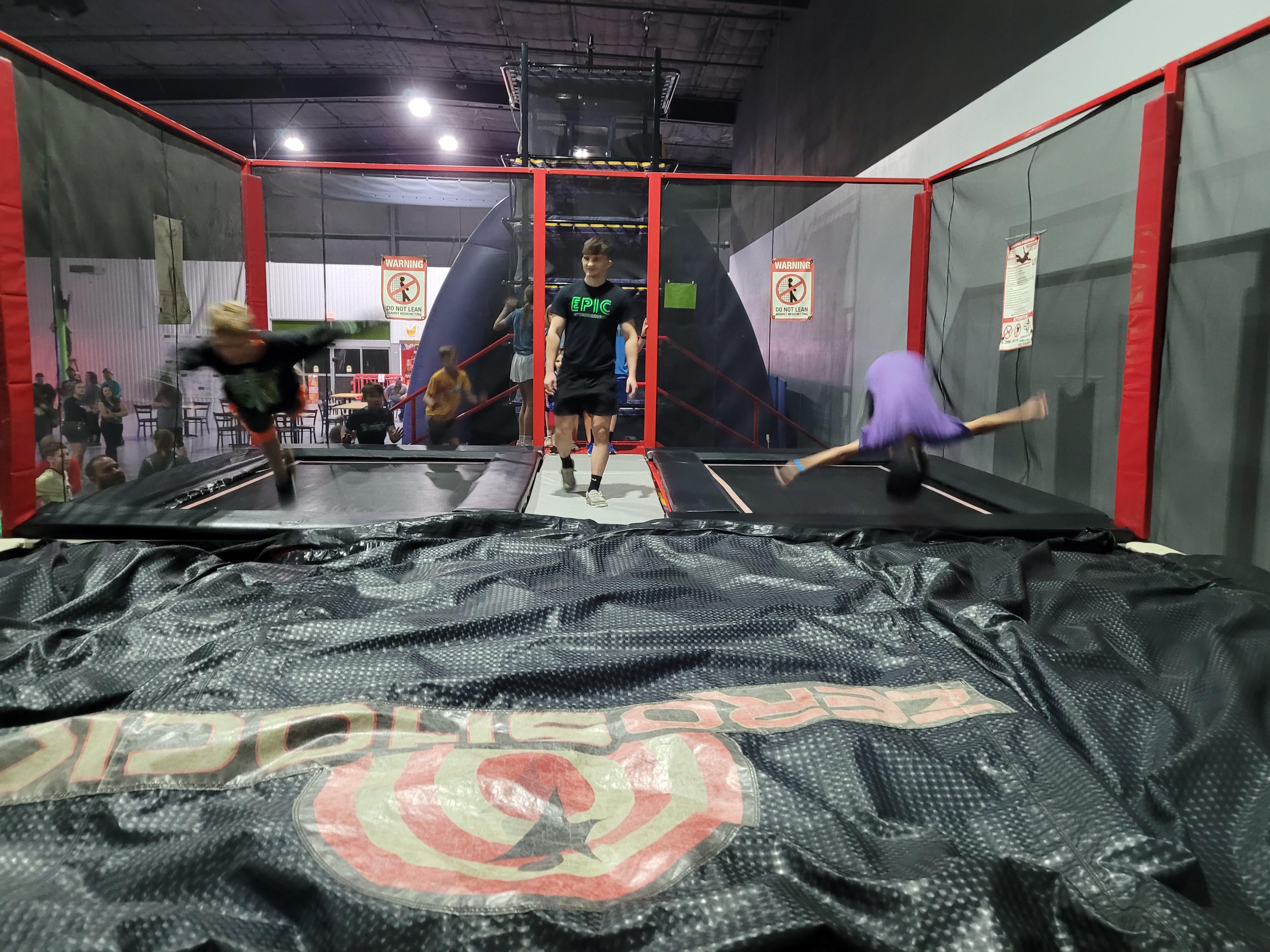 Kids on a trampoline-style attraction at EPIC Entertainment.