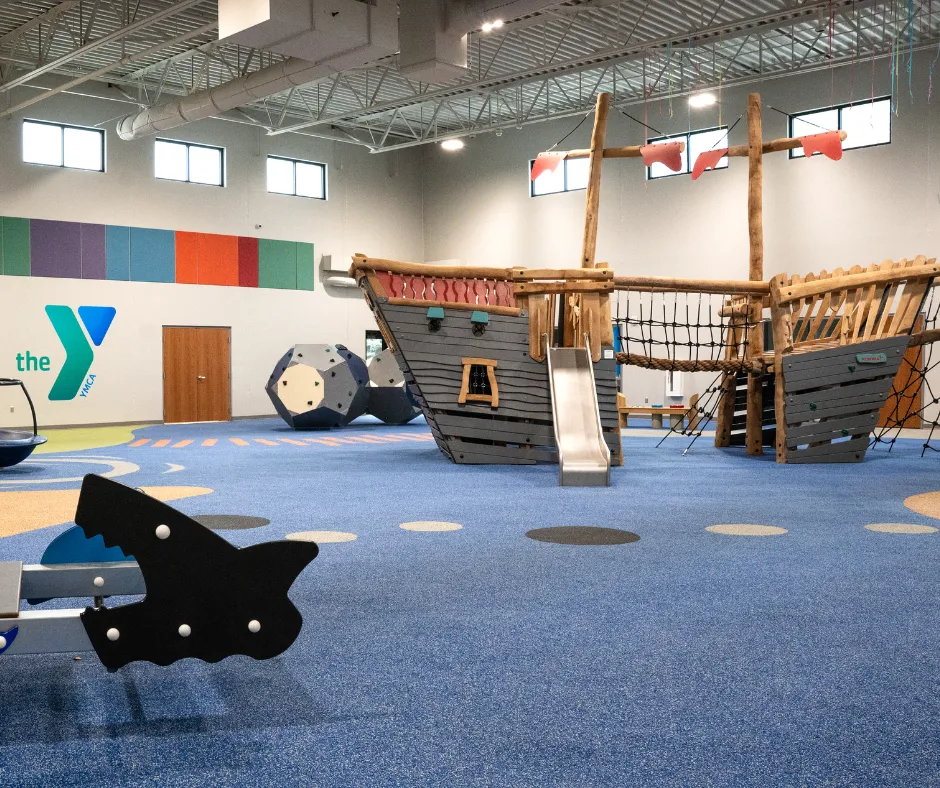 Wide view of the pirate-ship play structure at Explorer's Cove.