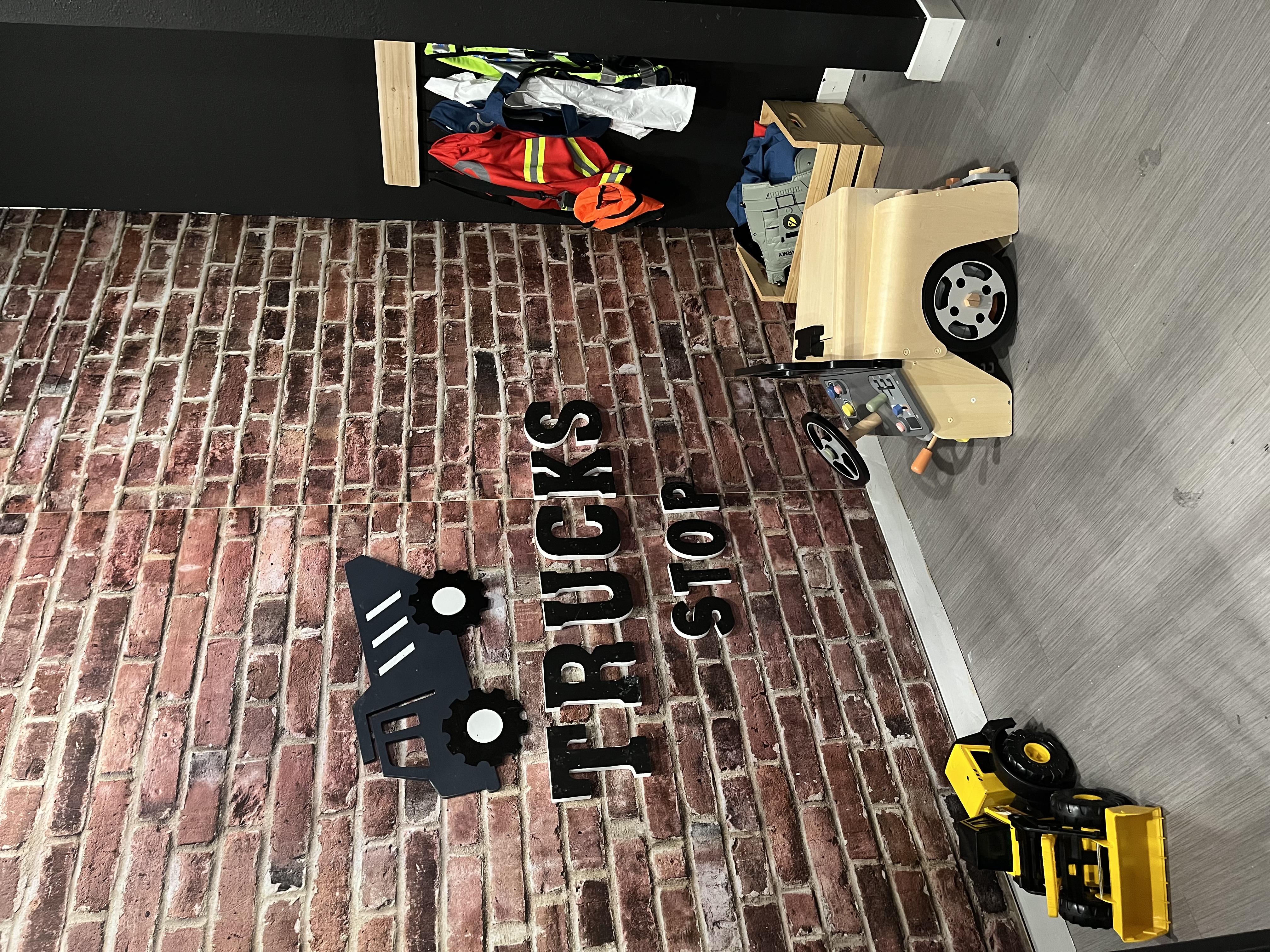 Construction-themed pretend-play corner inside Fargo Kids Play Museum.
