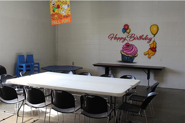 Party room or seating area at First Season Community Center.