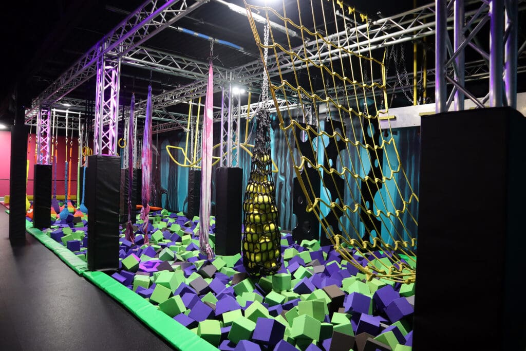 Rope obstacle course above a foam pit at Flying Squirrel Moscow.