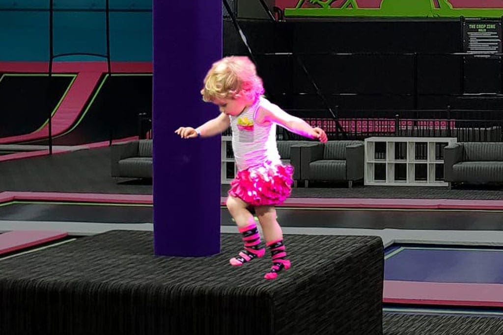 Young child using a toddler jump area at Flying Squirrel Moscow.