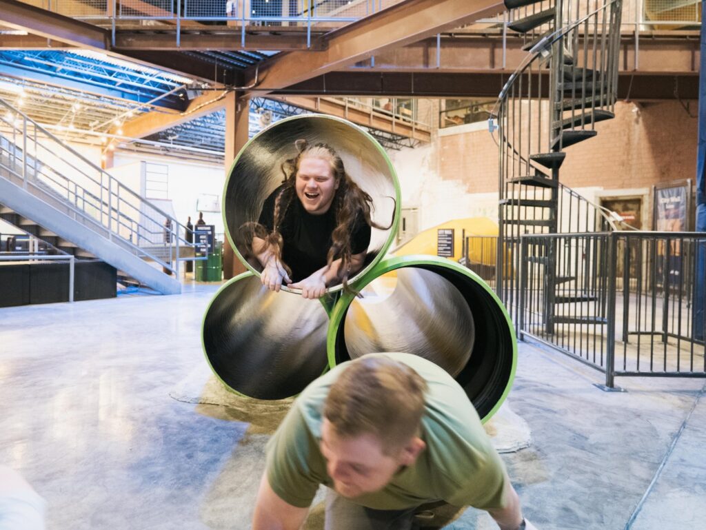 Guests on indoor bridges and elevated play features at Fritz's Adventure.