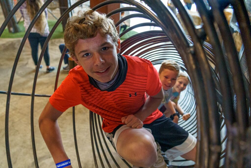 Kids climbing through adventure elements at Fritz's Adventure.