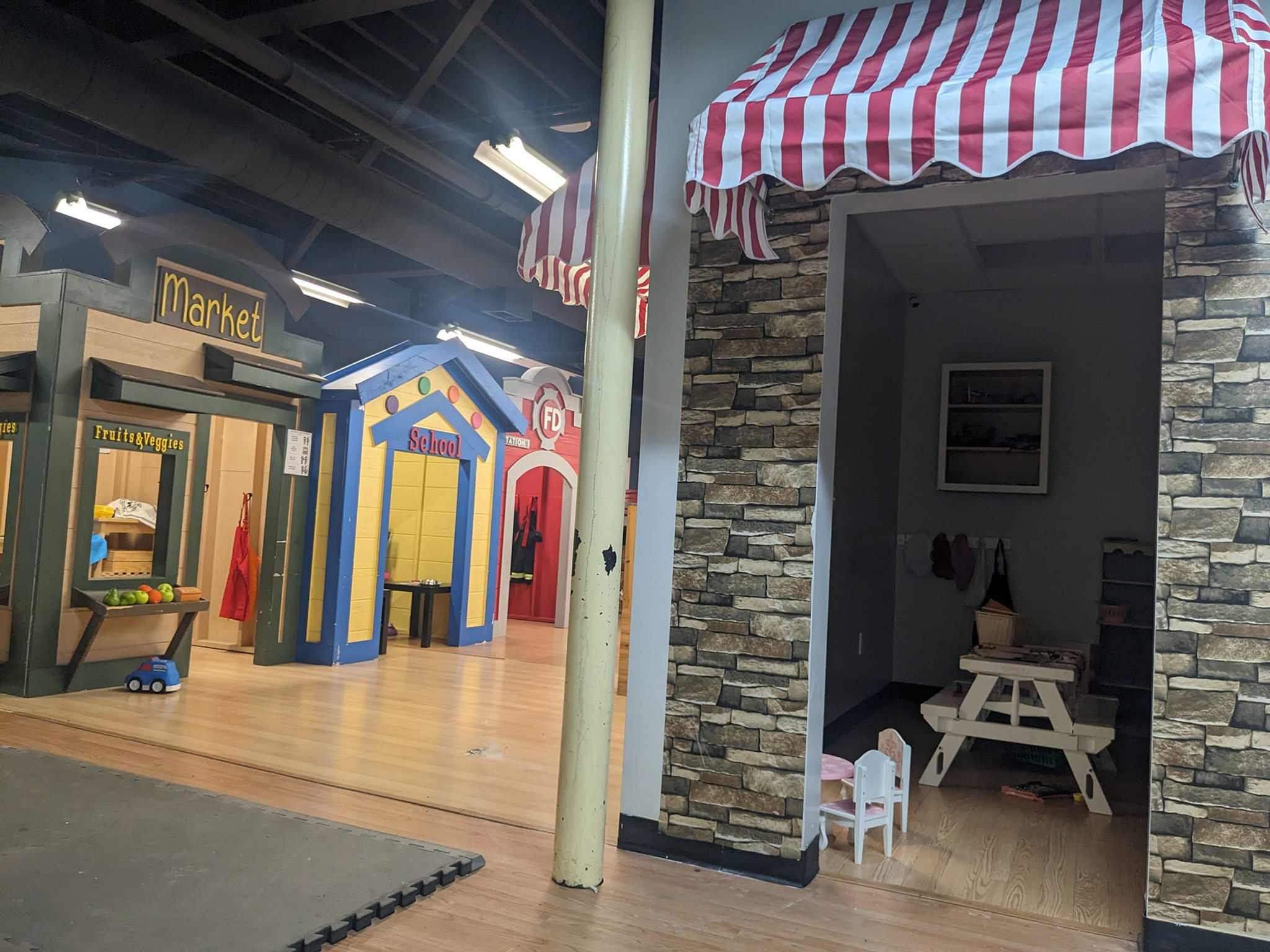 Tiny Town storefront-style pretend play area at Fun Factory.