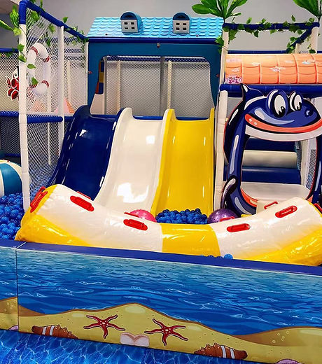 Indoor play area at Fun N Play with climbing and slide features.