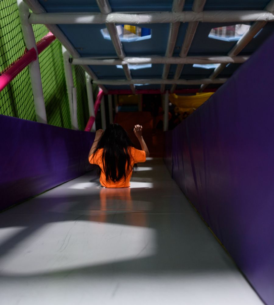 Slide inside Fun City's indoor playground structure.