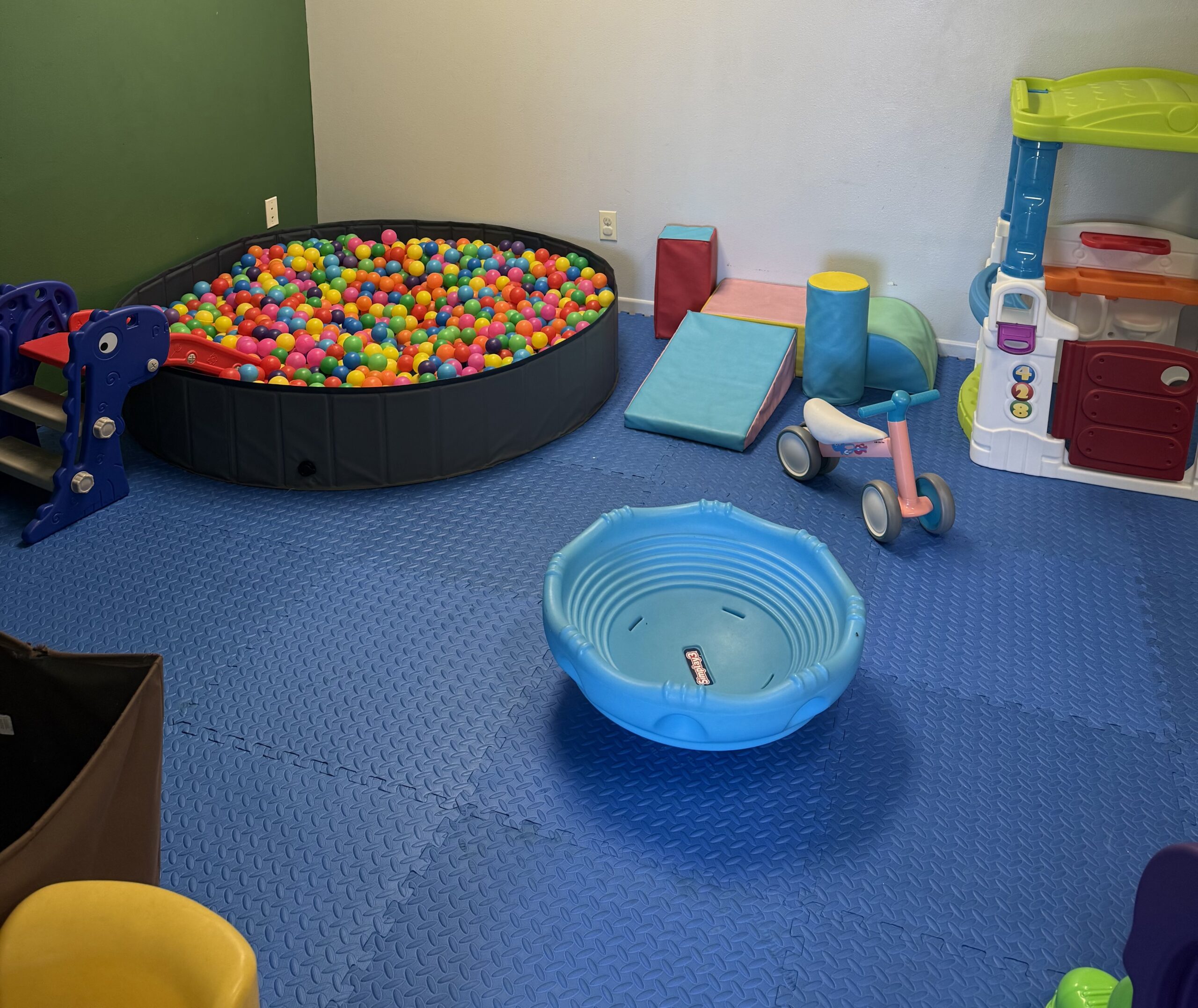 Toddler play corner with ball pit and soft mats at Garden City Fun Zone