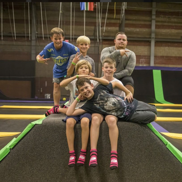 Kids gathered on a trampoline feature at Get Air Prescott.