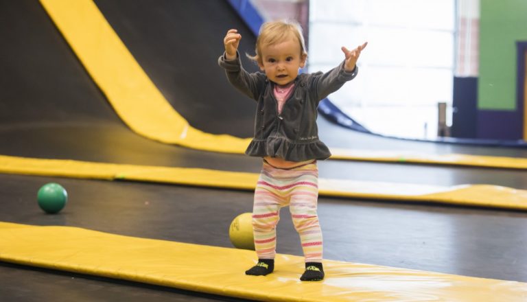 Toddler on a trampoline in Get Air Yuma's kiddie area