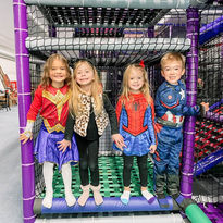 Children standing inside the play structure at GG's Playland