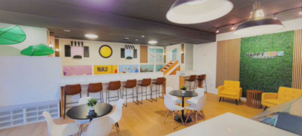 Play area and seating at Happy Kidz Play Cafe.