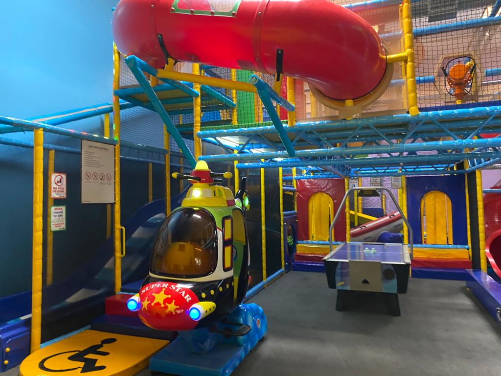 Play features and open activity space inside Hide n Seek Indoor Playground.