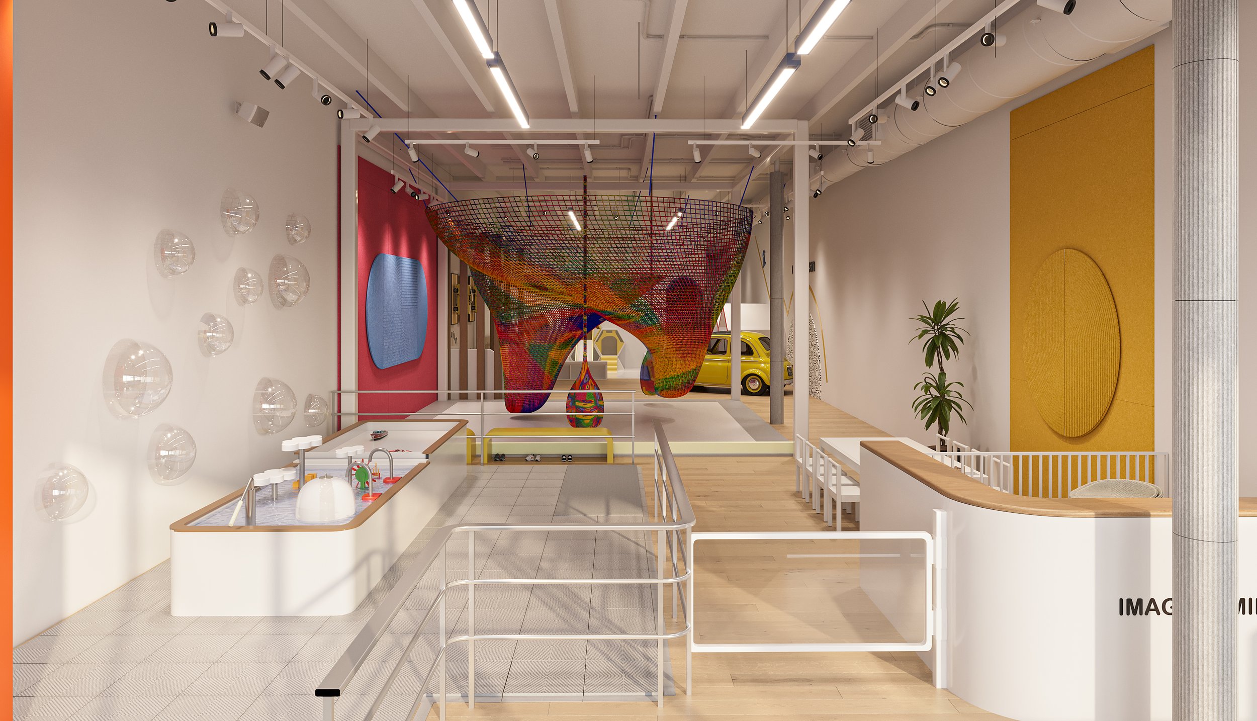 Open play floor and art table at Imagine Minds.